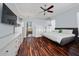 Spacious main bedroom with hardwood floors and an attached bath with a view at 2638 Clarinet Dr, Orlando, FL 32837