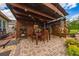Outdoor patio features a dining area, tropical plants, and covered structure at 2638 Clarinet Dr, Orlando, FL 32837