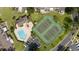 Community pool and tennis courts, with ample parking and green spaces at 2719 Candlewood Ct, Apopka, FL 32703