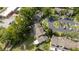 Aerial view of townhouse complex with tree lined street and plenty of parking spaces at 2719 Candlewood Ct, Apopka, FL 32703