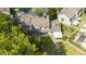Aerial view of the townhouse backyard with mature trees and patio areas, plenty of space at 2719 Candlewood Ct, Apopka, FL 32703