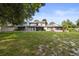Spacious backyard with lush green grass and patio for outdoor enjoyment at 2719 Candlewood Ct, Apopka, FL 32703