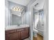 Bathroom with a light wood floor and a combination shower and tub at 2719 Candlewood Ct, Apopka, FL 32703