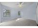 Bedroom with a ceiling fan and two windows at 2719 Candlewood Ct, Apopka, FL 32703