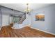 View of dining area with stairs and pass through window to the kitchen at 2719 Candlewood Ct, Apopka, FL 32703