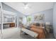 Spacious main bedroom with natural light, ceiling fan, and ensuite bathroom at 2719 Candlewood Ct, Apopka, FL 32703