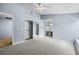 Carpeted main bedroom with closet and adjoining bath at 2719 Candlewood Ct, Apopka, FL 32703