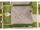 Birds eye view of the property showcasing lush landscaping, a fire pit, and surrounding neighborhood at 2896 Matera Dr, St Cloud, FL 34771