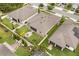 Beautiful backyard with a white fence, patio, fire pit, and well-manicured landscaping at 2896 Matera Dr, St Cloud, FL 34771