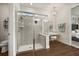 Bright bathroom showcasing glass shower, wood flooring, vanity, and modern fixtures at 2896 Matera Dr, St Cloud, FL 34771