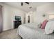 Comfortable bedroom with a neutral palette, plush bedding, and a modern dresser for a serene retreat at 2896 Matera Dr, St Cloud, FL 34771