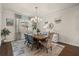 Elegant dining room with a chandelier, large window, and seating for six at 2896 Matera Dr, St Cloud, FL 34771