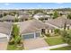 Beautiful single-Gathering home with a three-car garage, a well-maintained lawn, and manicured landscaping at 2896 Matera Dr, St Cloud, FL 34771