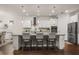 Well-appointed kitchen featuring an island with bar seating, modern appliances, and ample cabinet space at 2896 Matera Dr, St Cloud, FL 34771