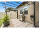 Outdoor living featuring a stainless steel grill and pergola, ideal for entertaining in this home's private patio at 2896 Matera Dr, St Cloud, FL 34771