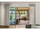 Enclosed patio overlooking an outdoor living space featuring outdoor furniture at 2896 Matera Dr, St Cloud, FL 34771