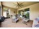 Enclosed patio area showcasing outdoor furniture and a telescope at 2896 Matera Dr, St Cloud, FL 34771