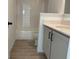 Bathroom featuring vanity with a modern sink and white cabinets at 2971 Embark Trail, St Cloud, FL 34771