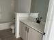 Bathroom featuring vanity with a modern sink and white cabinets at 2971 Embark Trail, St Cloud, FL 34771