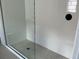 Modern bathroom featuring a tiled shower with glass door and sleek black fixtures at 2971 Embark Trail, St Cloud, FL 34771