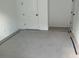 Carpeted bedroom with door and closet at 2971 Embark Trail, St Cloud, FL 34771