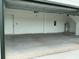 Spacious two car garage showcasing ample space and a clean, modern design at 2971 Embark Trail, St Cloud, FL 34771