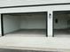 Two-car garage with modern doors, offering ample space and functionality at 2971 Embark Trail, St Cloud, FL 34771