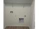 Empty laundry room with tile flooring, shelving and hookups at 2971 Embark Trail, St Cloud, FL 34771