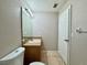 Bathroom featuring a sink, vanity, and toilet at 306 Snook Way, Kissimmee, FL 34759