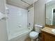 Bathroom featuring a tub, toilet, and vanity at 306 Snook Way, Kissimmee, FL 34759
