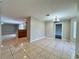 Open-concept dining room area showcasing tile flooring and seamless flow into the kitchen at 306 Snook Way, Kissimmee, FL 34759