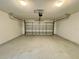 This expansive two-car garage features epoxy flooring, enhancing both durability and aesthetic appeal at 306 Snook Way, Kissimmee, FL 34759