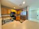 Well-lit kitchen features stainless steel appliances and ample cabinet space at 306 Snook Way, Kissimmee, FL 34759