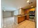 Bright kitchen with stainless steel appliances and open layout, perfect for modern living at 306 Snook Way, Kissimmee, FL 34759
