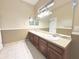 Bright bathroom with a double vanity, a large mirror, and plenty of counter space at 3100 Pine Needle Trl, Kissimmee, FL 34746
