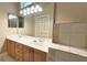 Bathroom featuring double sinks, a large vanity, and a big mirror at 3100 Pine Needle Trl, Kissimmee, FL 34746