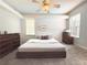 Bright bedroom featuring a ceiling fan, neutral colors, and plenty of natural light at 3100 Pine Needle Trl, Kissimmee, FL 34746