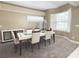 Contemporary dining room with modern chandelier and plenty of natural light at 3100 Pine Needle Trl, Kissimmee, FL 34746