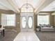 Bright foyer featuring a tiled floor, chandelier, and bay windows at 3100 Pine Needle Trl, Kissimmee, FL 34746