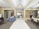 Spacious living area with stone fireplace and open floor plan at 3100 Pine Needle Trl, Kissimmee, FL 34746