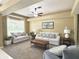 Inviting living room with plush seating, ceiling fan, and bay window at 3100 Pine Needle Trl, Kissimmee, FL 34746