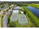 Community clubhouse with tennis courts, pool, and amenity center providing a resort-style experience at 3131 Regal Darner Dr, Kissimmee, FL 34744