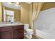 Comfortable bathroom with a single vanity, toilet, and tiled shower/tub combo at 3131 Regal Darner Dr, Kissimmee, FL 34744