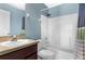Standard bathroom with white shower-tub, updated hardware, and vanity sink at 3131 Regal Darner Dr, Kissimmee, FL 34744