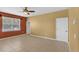 Cozy bedroom with tile floors, neutral walls, and a window offering ample natural light at 3131 Regal Darner Dr, Kissimmee, FL 34744