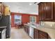 Kitchen with a breakfast nook, stainless steel dishwasher, and view of the water outside the window at 3131 Regal Darner Dr, Kissimmee, FL 34744