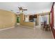 Open-concept living space featuring tile flooring and a combined kitchen and dining area at 3131 Regal Darner Dr, Kissimmee, FL 34744