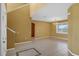 Open-plan living room with tiled floors, high ceilings, and natural light at 3131 Regal Darner Dr, Kissimmee, FL 34744