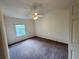 Light-filled bedroom with carpet, ceiling fan, and bright walls at 3352 Hamlet Loop, Winter Park, FL 32792