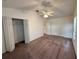 Spacious carpeted bedroom featuring ample closet space and a ceiling fan at 3352 Hamlet Loop, Winter Park, FL 32792